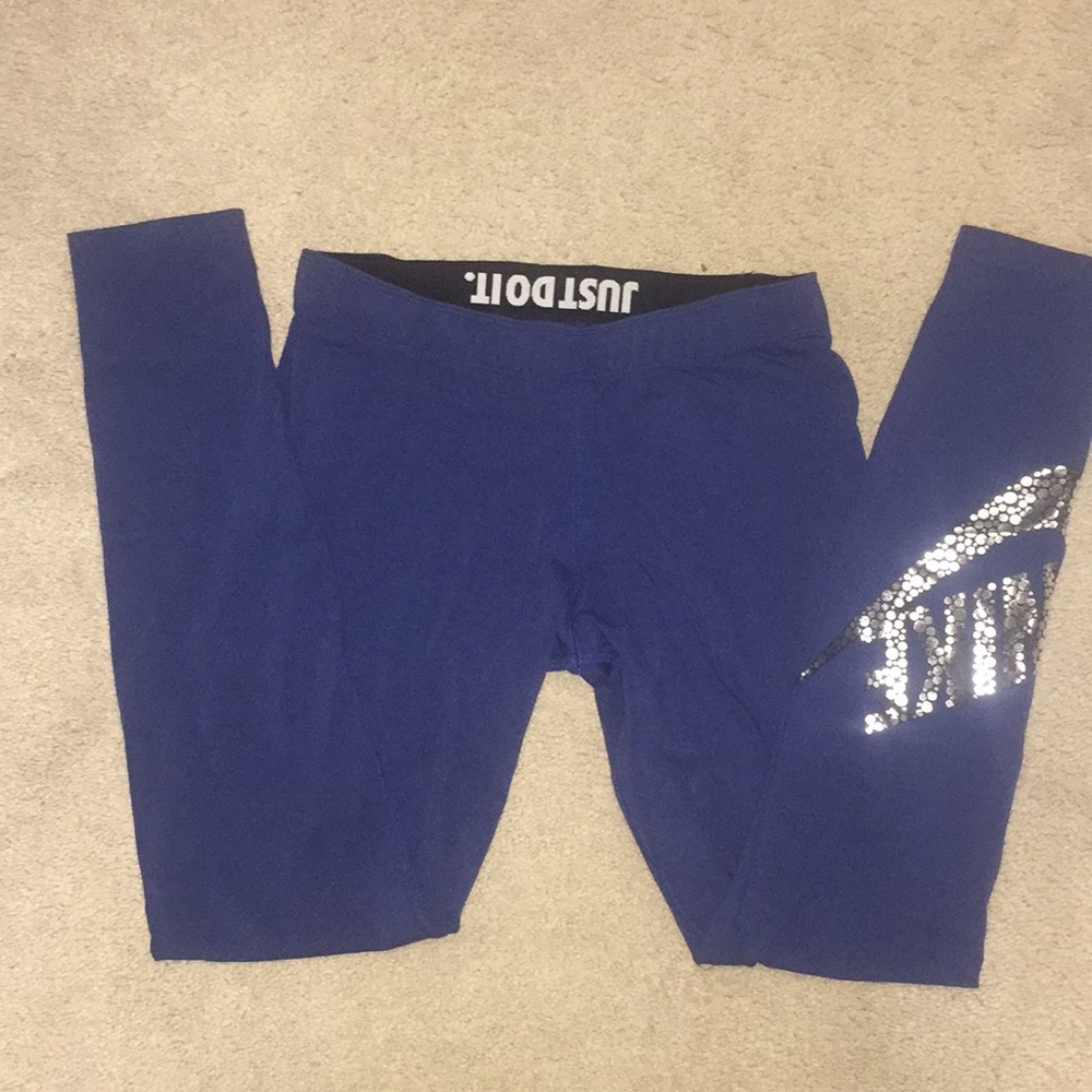 LIKE NEW. Nike legging with foil detail.